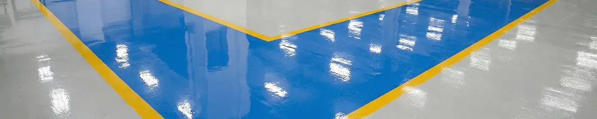 A factory floor professionally covered and marked with epoxy flooring in Chandler, AZ