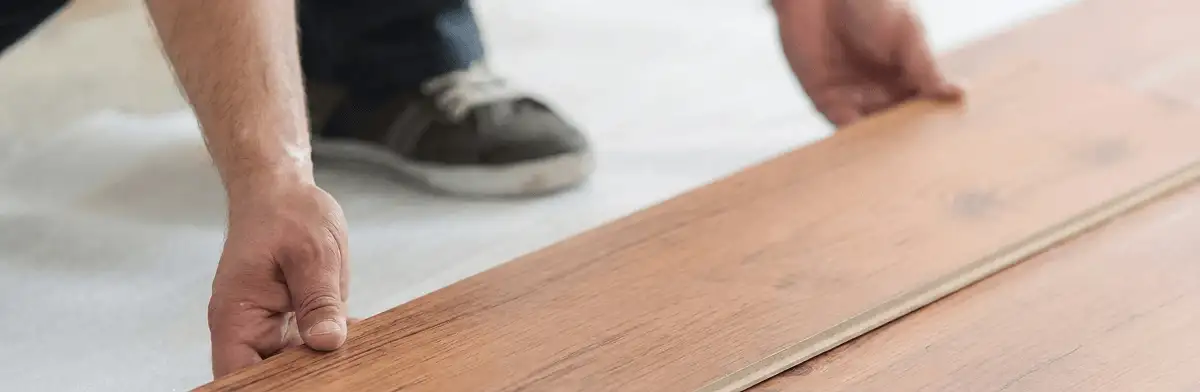 A professional installing laminate flooring in Chandler, AZ