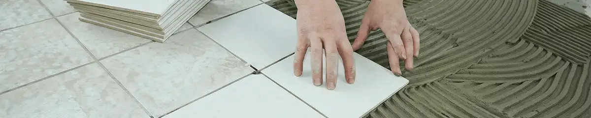 Professional installing white tile floors in Chandler, AZ
