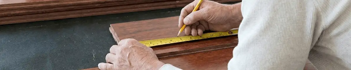 A professional installing wood flooring in Chandler, AZ